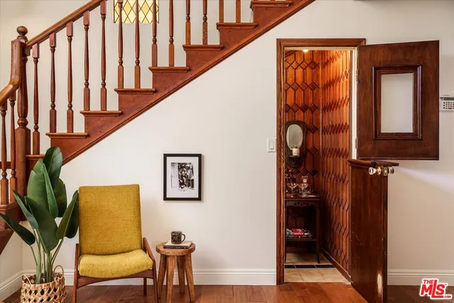 a view of hallway with furniture and a window