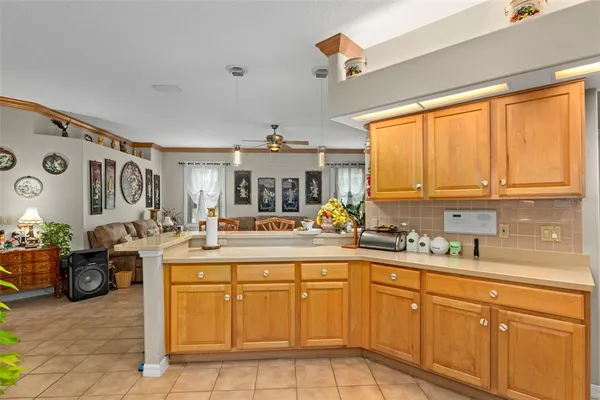 a kitchen with a sink and a stove top oven