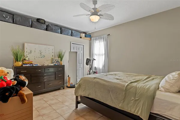 a bedroom with a bed and a dresser