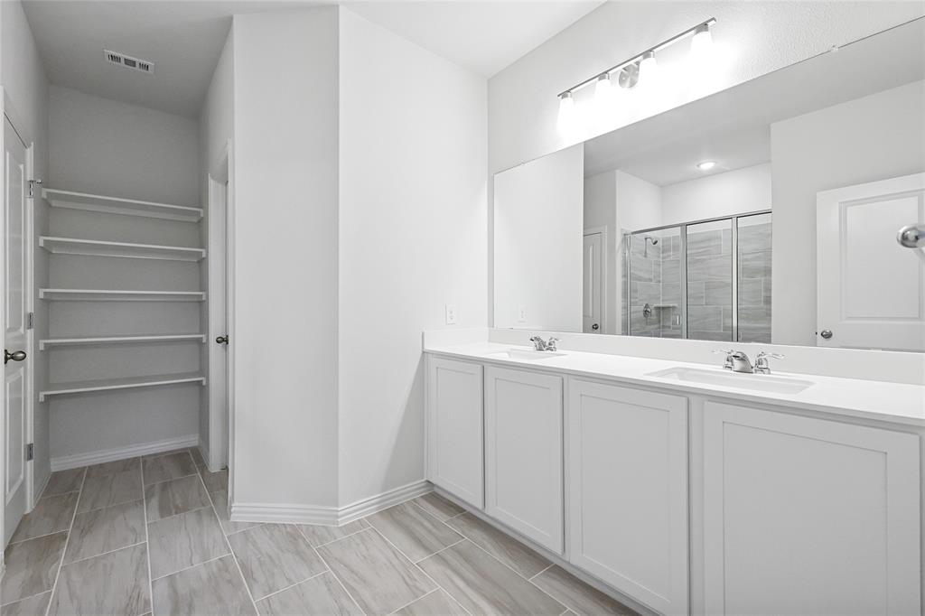 3900 Coco Lane Sherman, TX 75090 - Photo 12 of 40 Bathroom with vanity and walk in shower