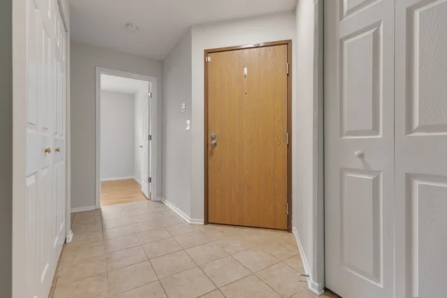 a view of a hallway with closet area