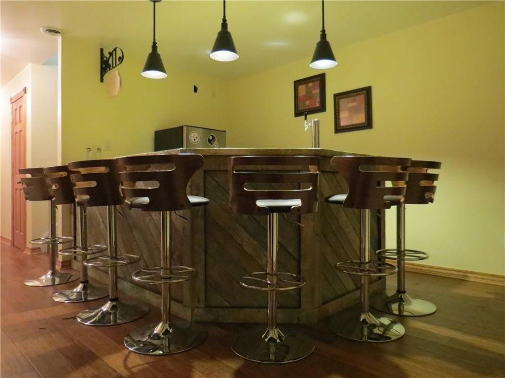 127 Alderson Road Saxonburg, PA 16056 - Photo 17 of 25 Plenty of room for entertaining at this custom bar which has a wet bar for easy cleanup!