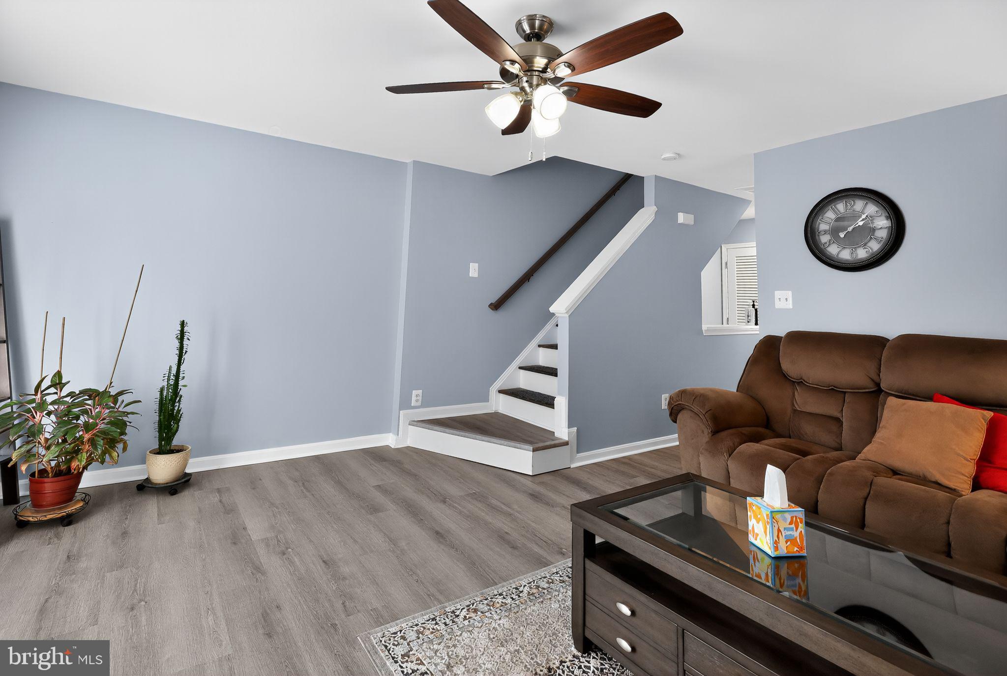 45481 Bluemont Junction Square Sterling, VA 20164 - Photo 11 of 30 a living room with furniture and a wooden floor
