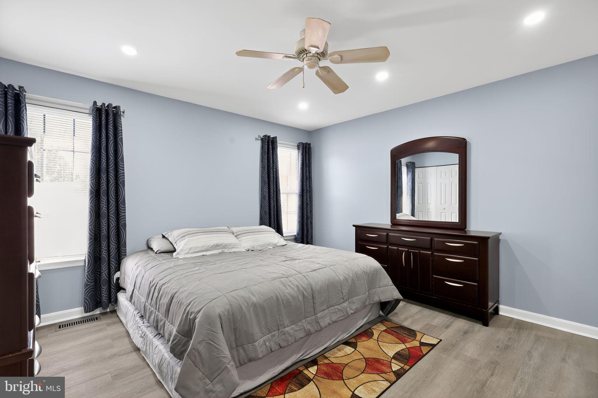 45481 Bluemont Junction Square Sterling, VA 20164 - Photo 15 of 30 a bedroom with a bed and a dresser