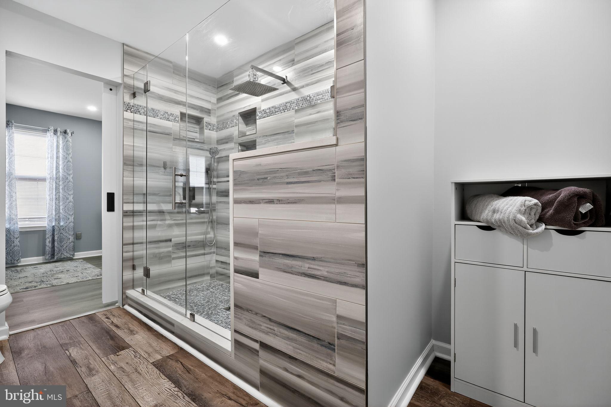 45481 Bluemont Junction Square Sterling, VA 20164 - Photo 18 of 30 a bathroom with a shower and a sink