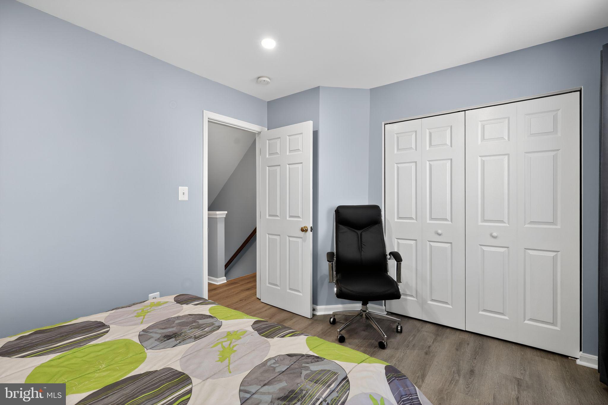 45481 Bluemont Junction Square Sterling, VA 20164 - Photo 21 of 30 a bed room with a bed and a chair