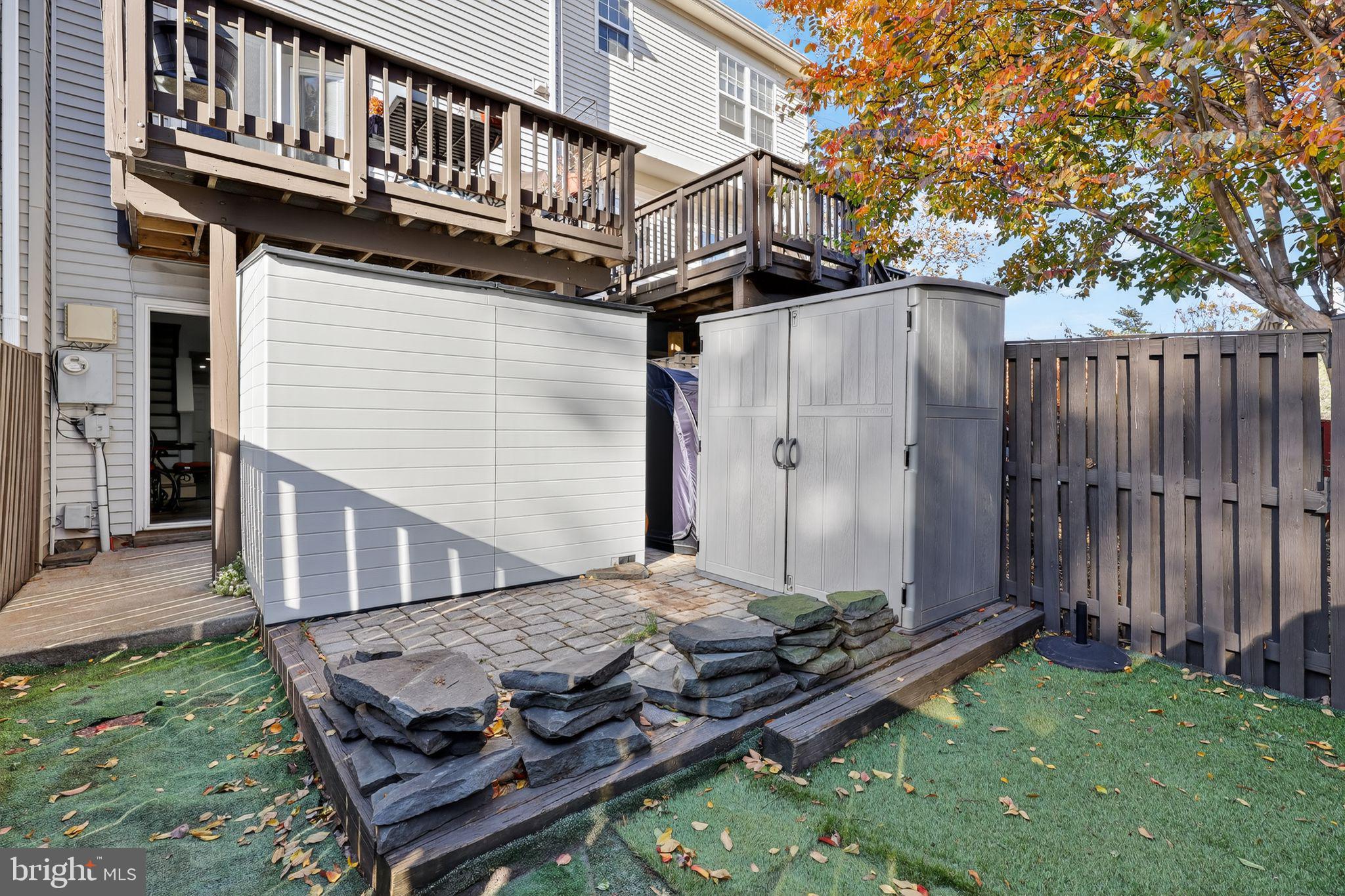 45481 Bluemont Junction Square Sterling, VA 20164 - Photo 25 of 30 a view of a house with backyard and wooden deck