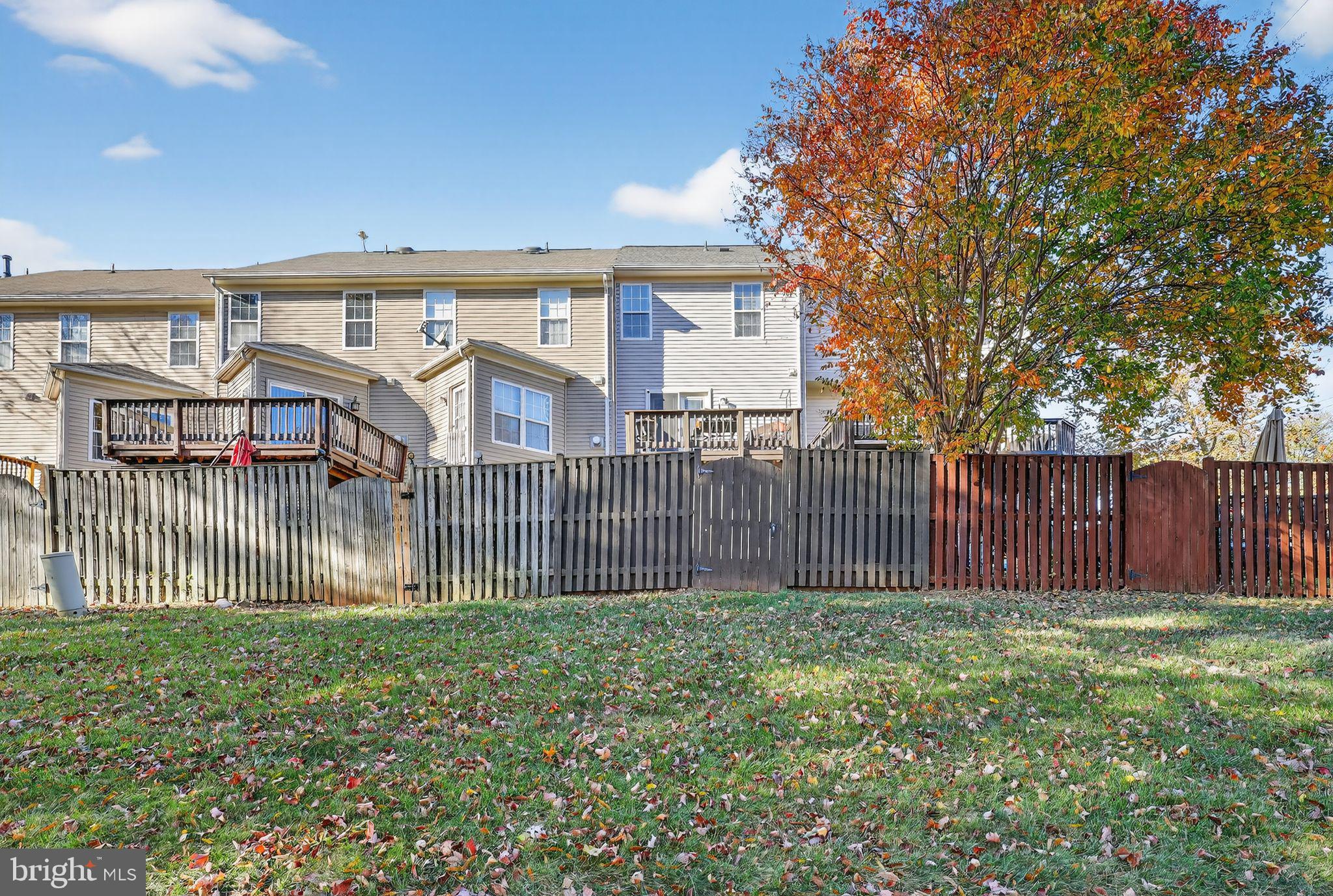45481 Bluemont Junction Square Sterling, VA 20164 - Photo 27 of 30 a front view of a house having yard