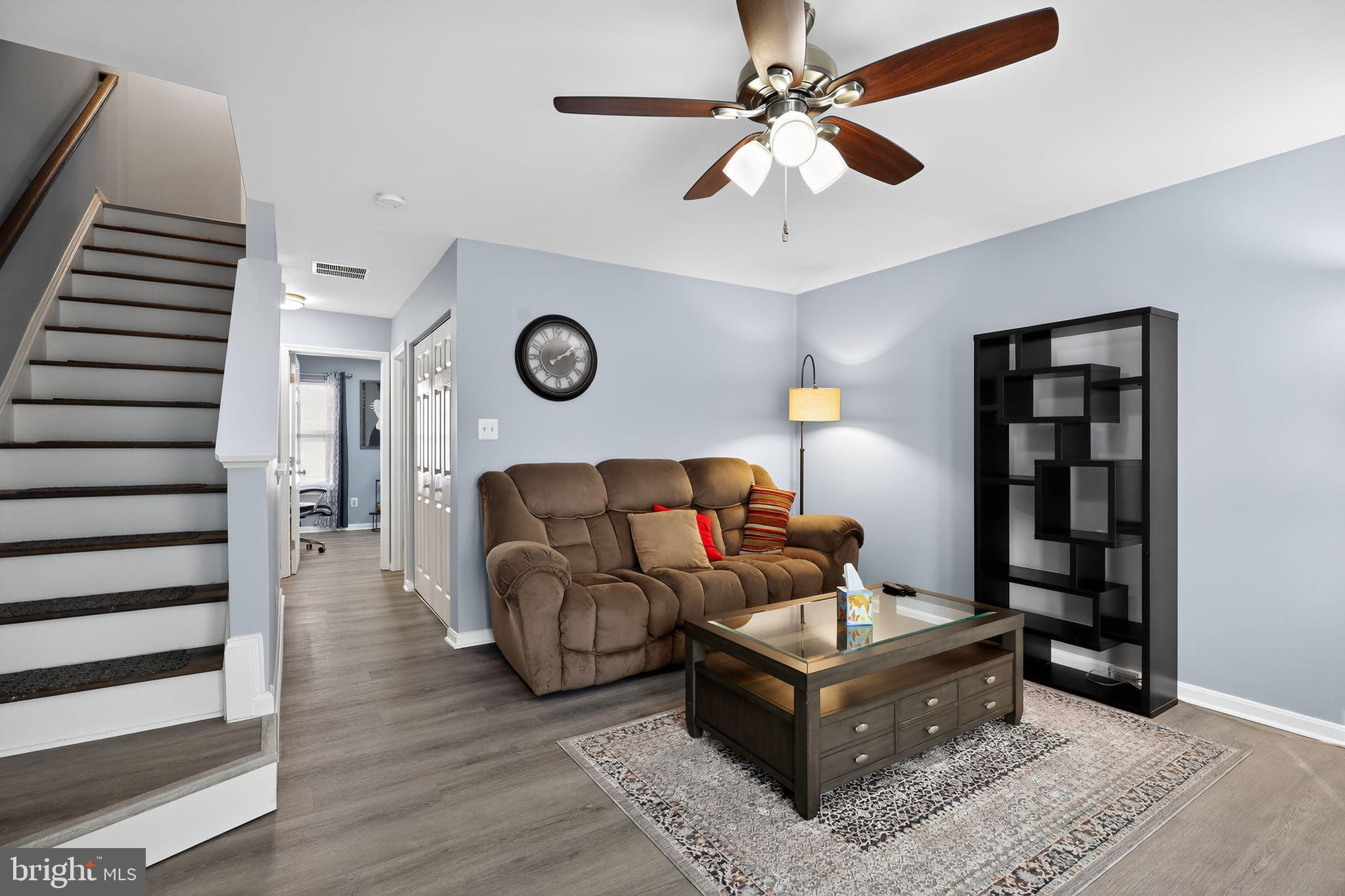 45481 Bluemont Junction Square Sterling, VA 20164 - Photo 9 of 30 a living room with furniture and a clock