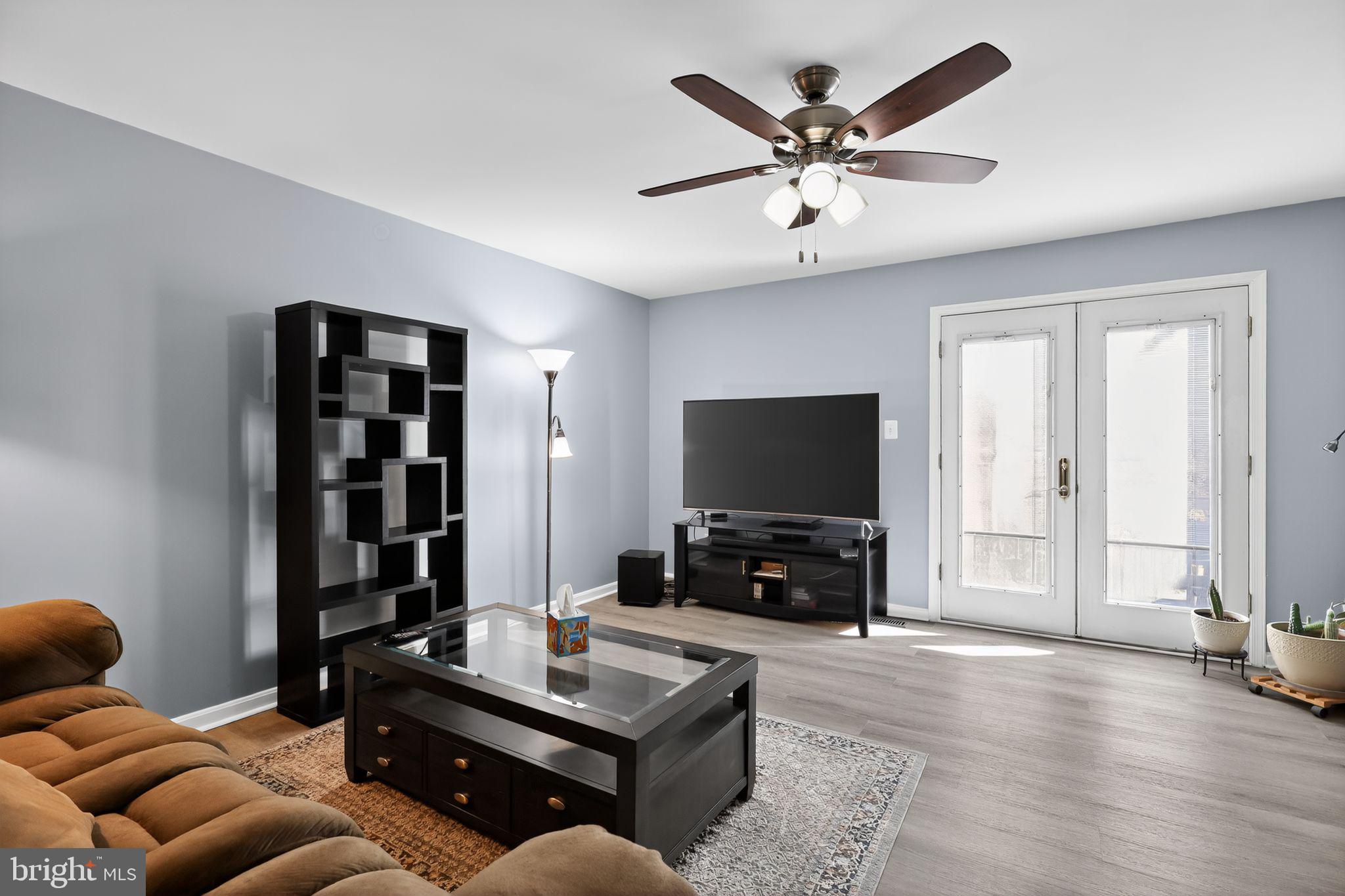 45481 Bluemont Junction Square Sterling, VA 20164 - Photo 10 of 30 a living room with furniture and a flat screen tv