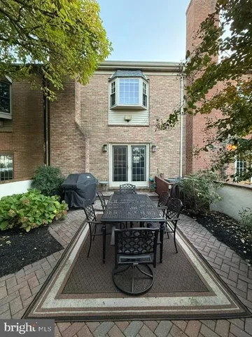 front view of a house with a bench