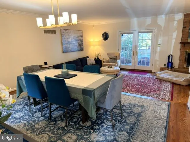 a view of a dining room with furniture and window