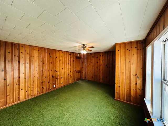 a kitchen with stainless steel appliances a stove a microwave and a refrigerator