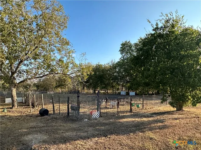 a view of street with trees in the background