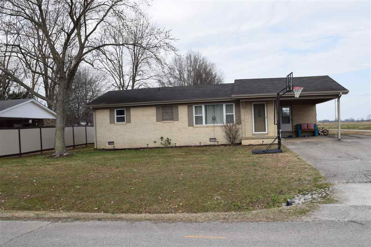 a view of a house with backyard