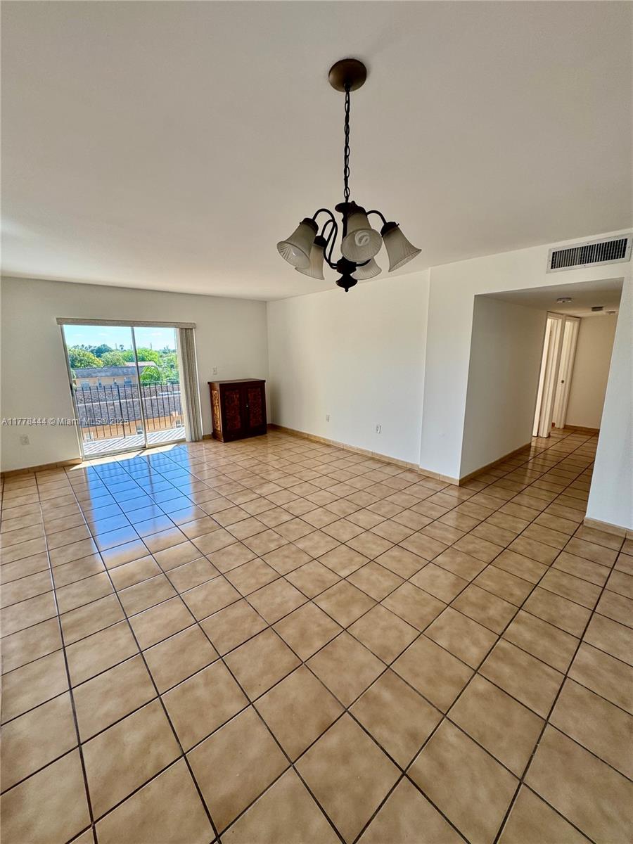 1075 West 68th Street, Unit 314 Hialeah, FL 33014 - Photo 2 of 27 a view of a livingroom with furniture