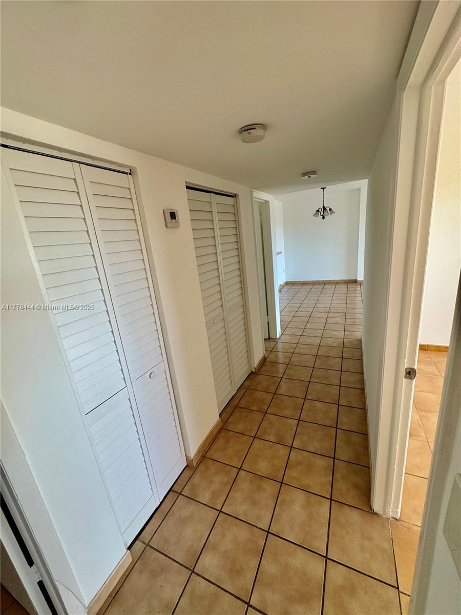 1075 West 68th Street, Unit 314 Hialeah, FL 33014 - Photo 23 of 27 a view of a hallway