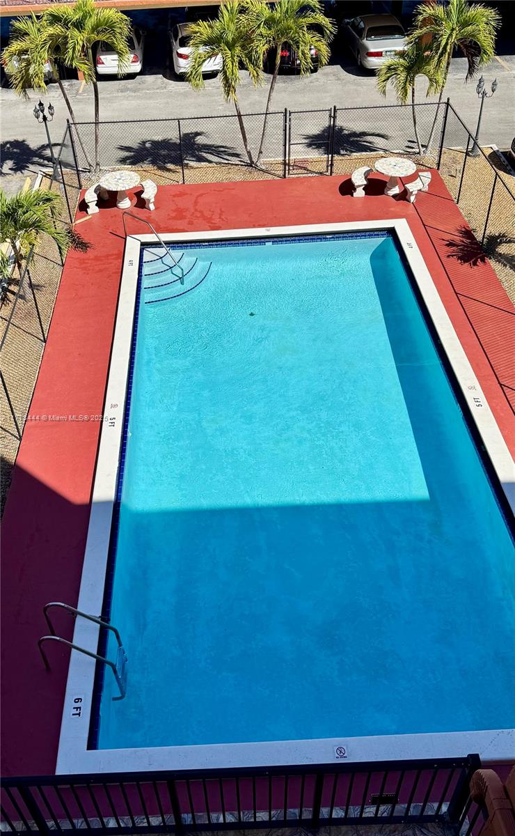 1075 West 68th Street, Unit 314 Hialeah, FL 33014 - Photo 26 of 27 a room with pool table and chairs