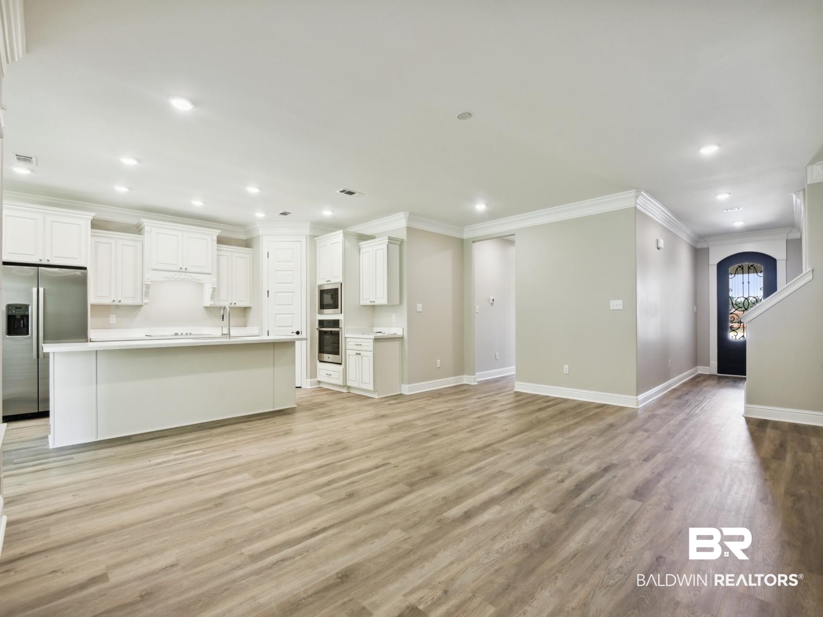 23937 Peppermint Street Elberta, AL 36530 - Photo 6 of 22 Unfurnished living room featuring ornamental molding, light wood-type flooring, and recessed lighting