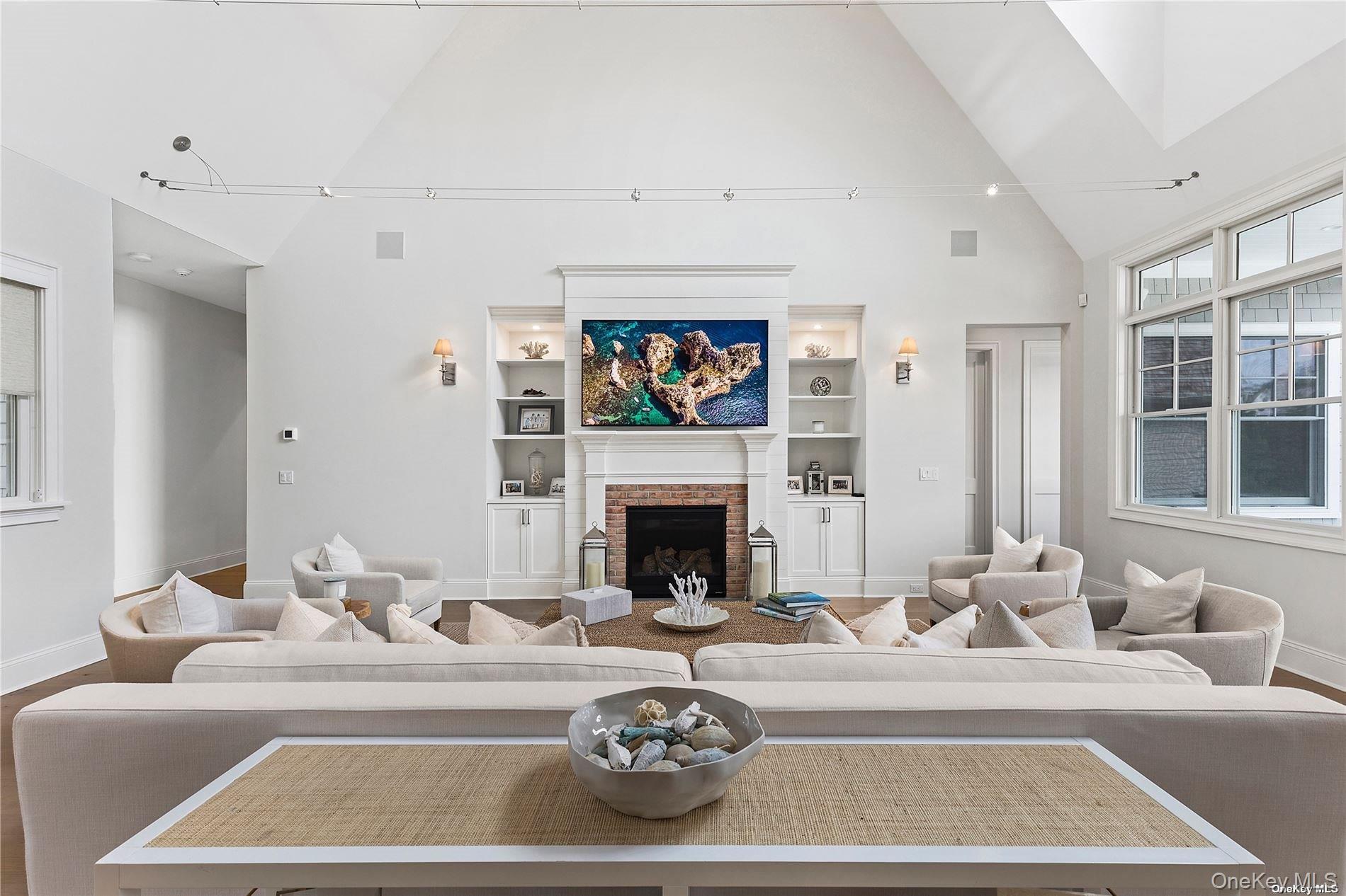 2 Emmas Path Remsenburg, NY 11960 - Photo 5 of 23 a living room with furniture a fireplace and a flat screen tv