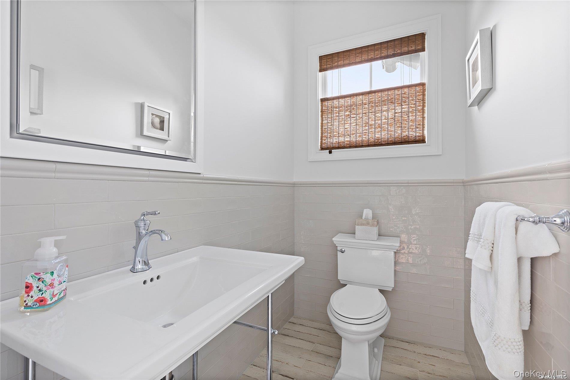 2 Emmas Path Remsenburg, NY 11960 - Photo 8 of 23 a white toilet sitting next to a bathroom sink