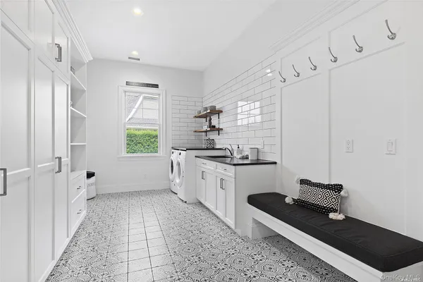 a kitchen with a refrigerator and a stove