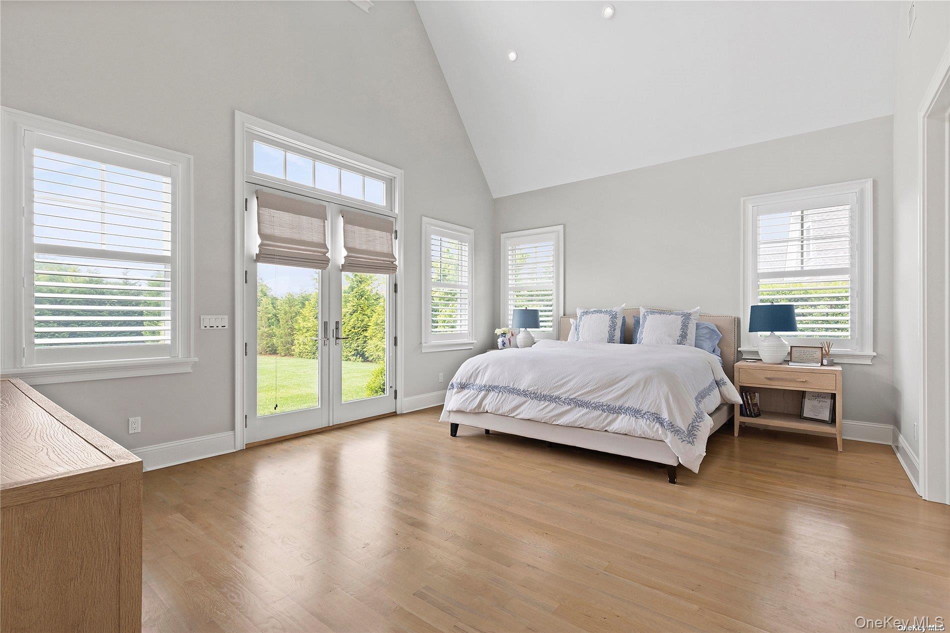 2 Emmas Path Remsenburg, NY 11960 - Photo 10 of 23 a bedroom with a large bed and a large window