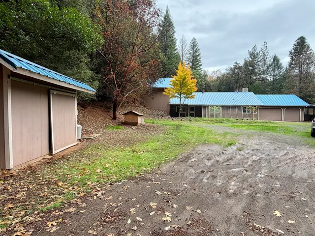 a dining room with furniture and a chandelier