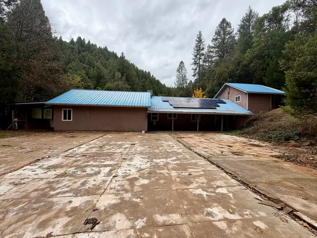 a kitchen with stainless steel appliances granite countertop a refrigerator and a stove