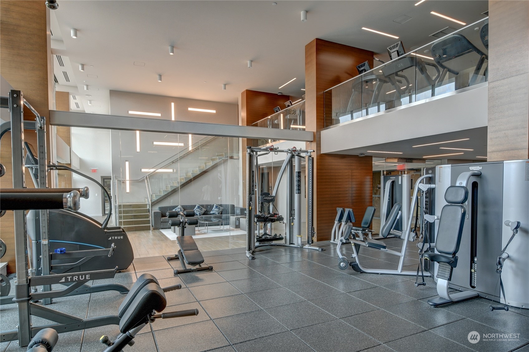 583 Battery Street, Unit 1601N Seattle, WA 98121 - Photo 14 of 27 a gym room with lots of gym equipment