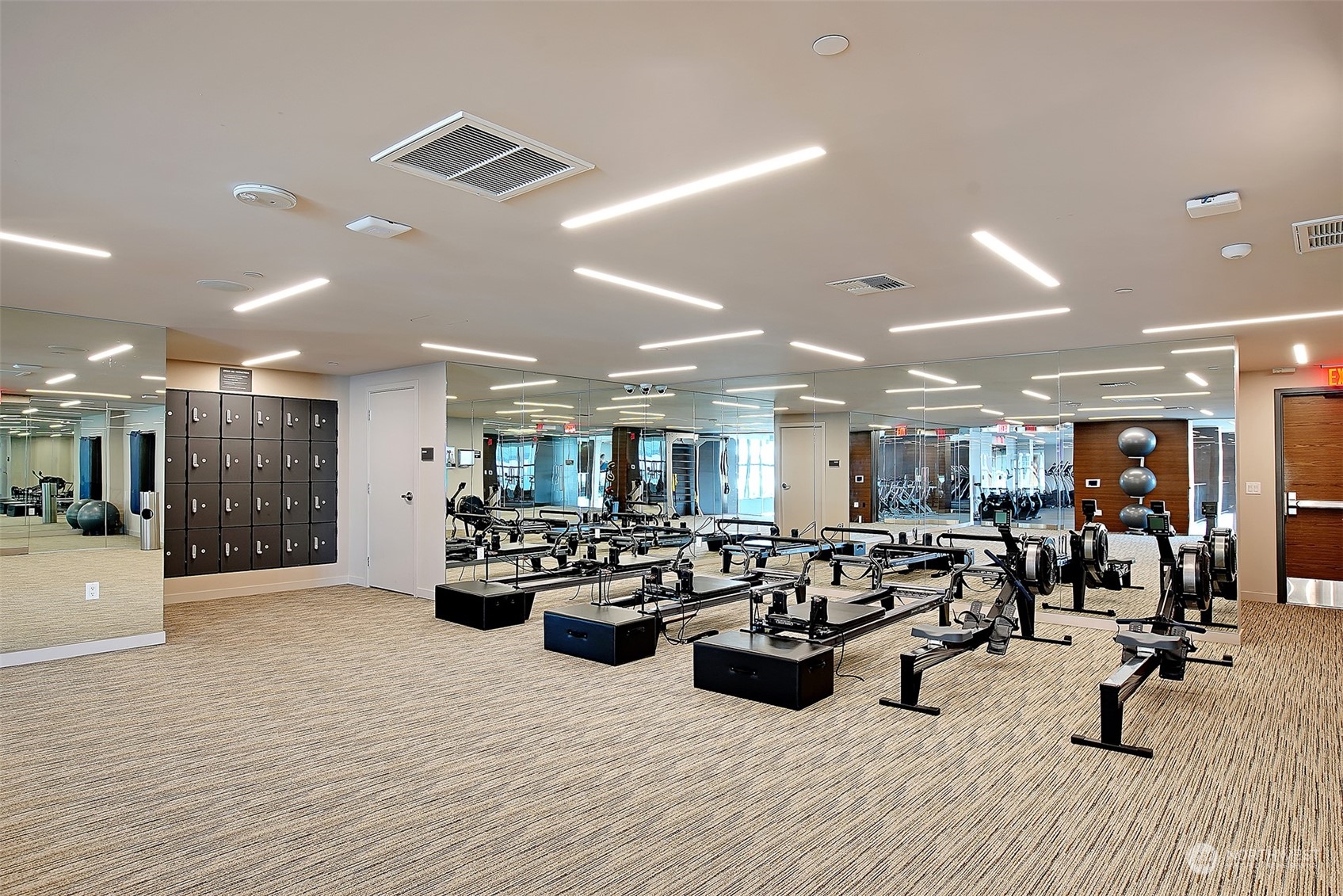 583 Battery Street, Unit 1601N Seattle, WA 98121 - Photo 15 of 27 a large room with gym equipment and view living room