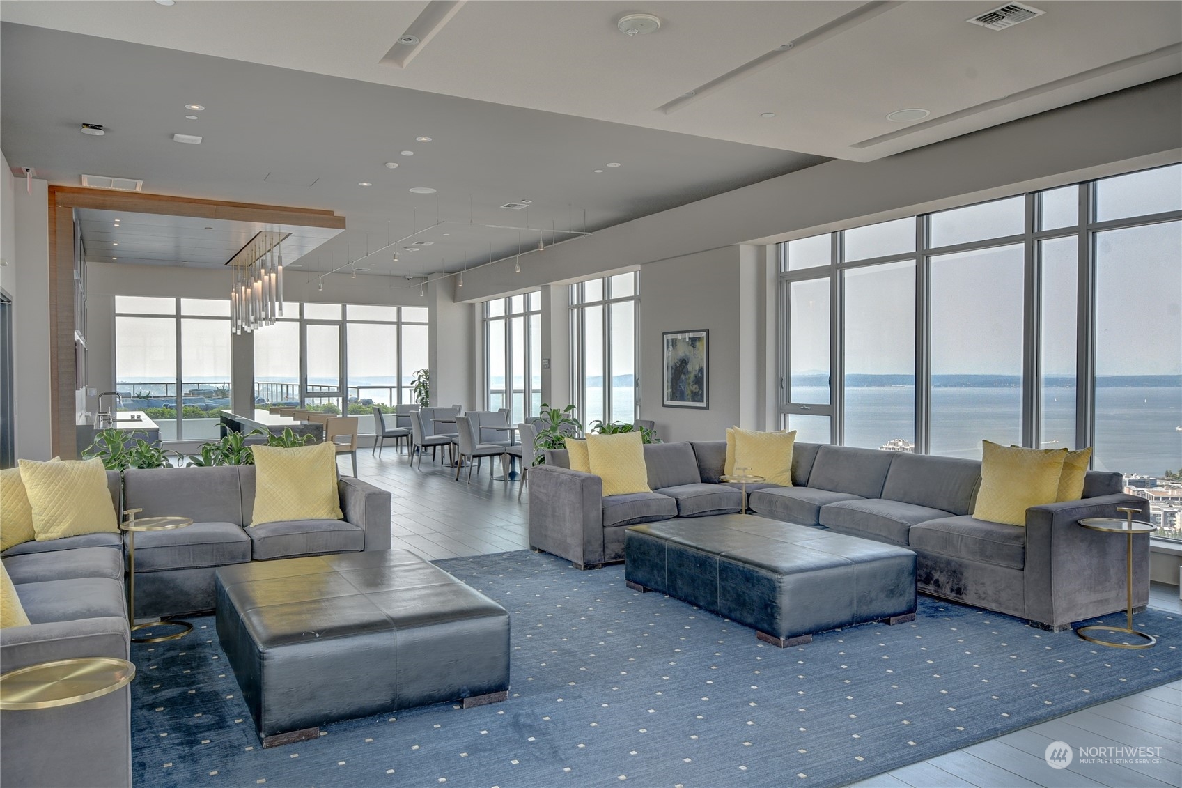 583 Battery Street, Unit 1601N Seattle, WA 98121 - Photo 17 of 27 a living room with furniture and floor to ceiling windows