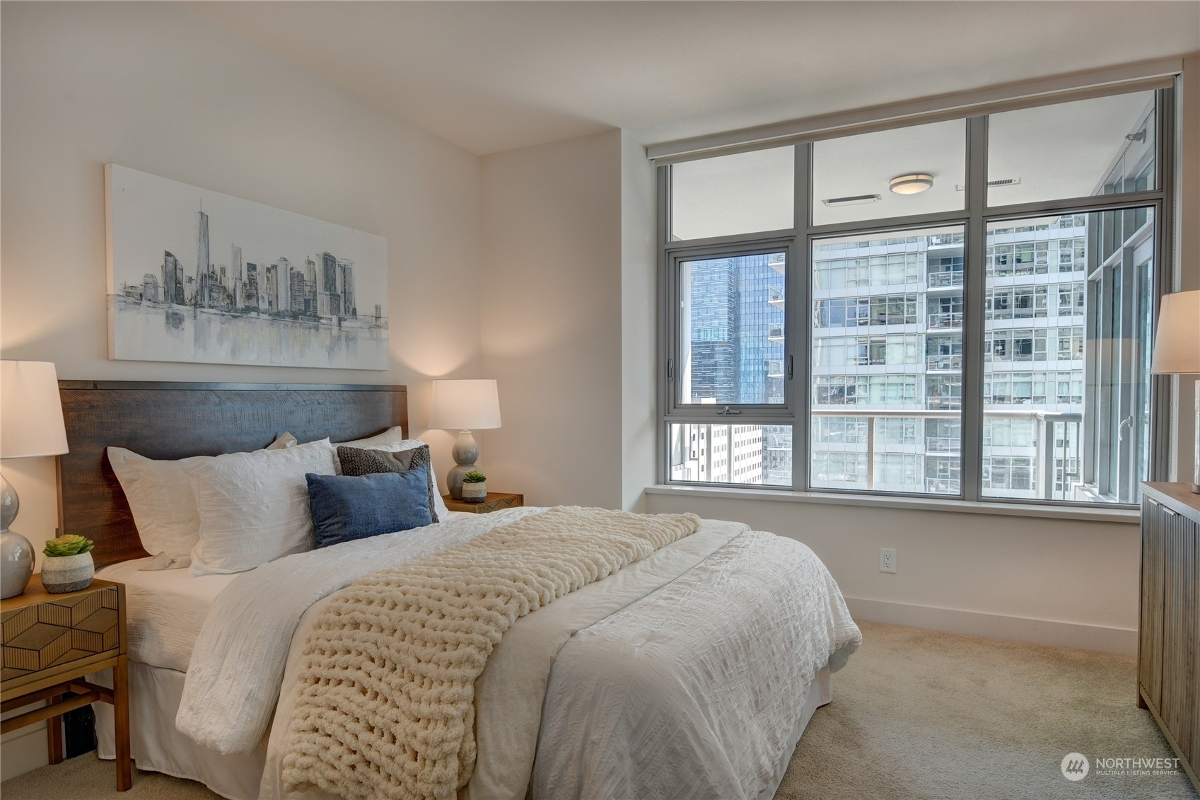 583 Battery Street, Unit 1601N Seattle, WA 98121 - Photo 7 of 27 a bedroom with a large bed and a window