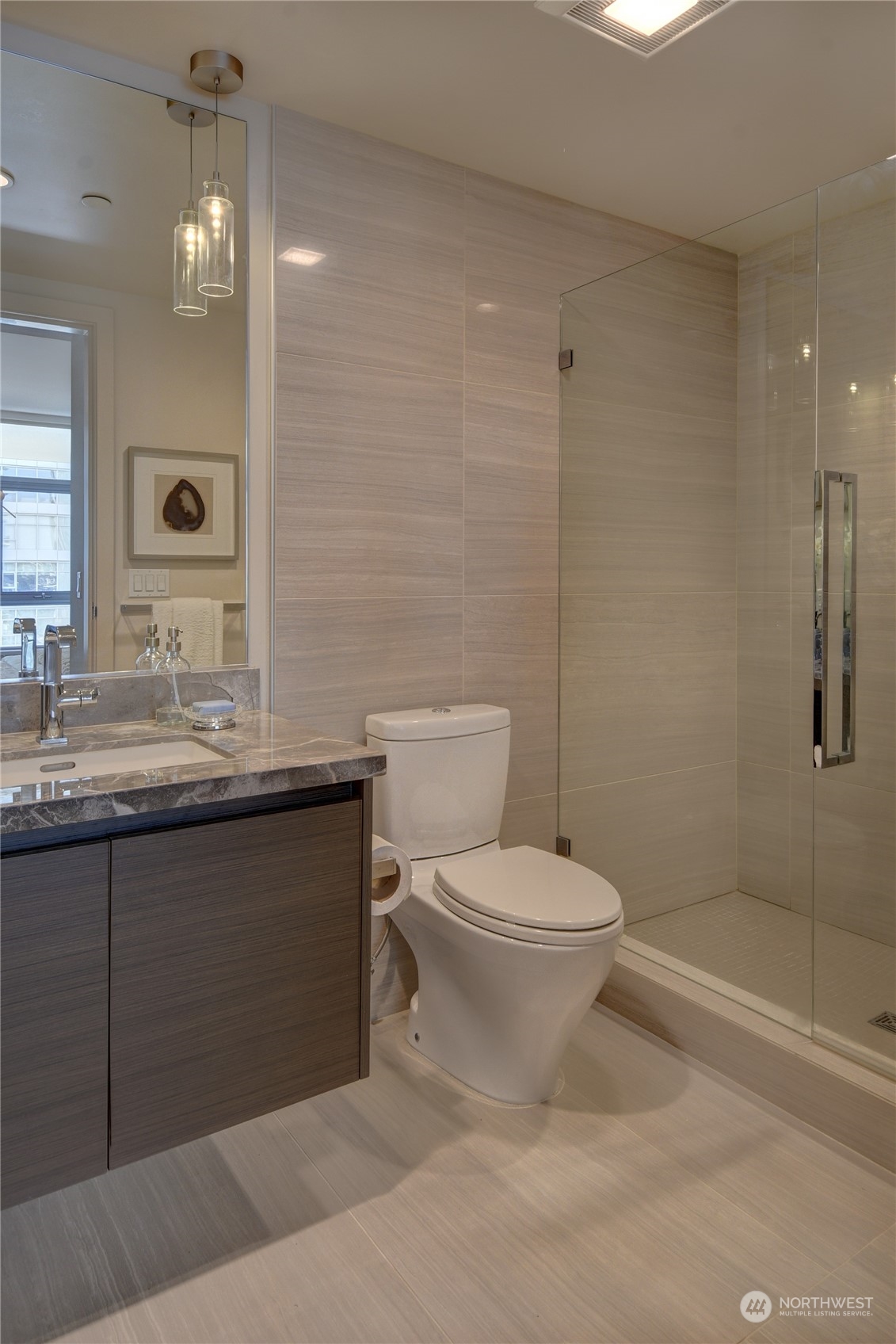583 Battery Street, Unit 1601N Seattle, WA 98121 - Photo 8 of 27 a bathroom with a sink a toilet and shower