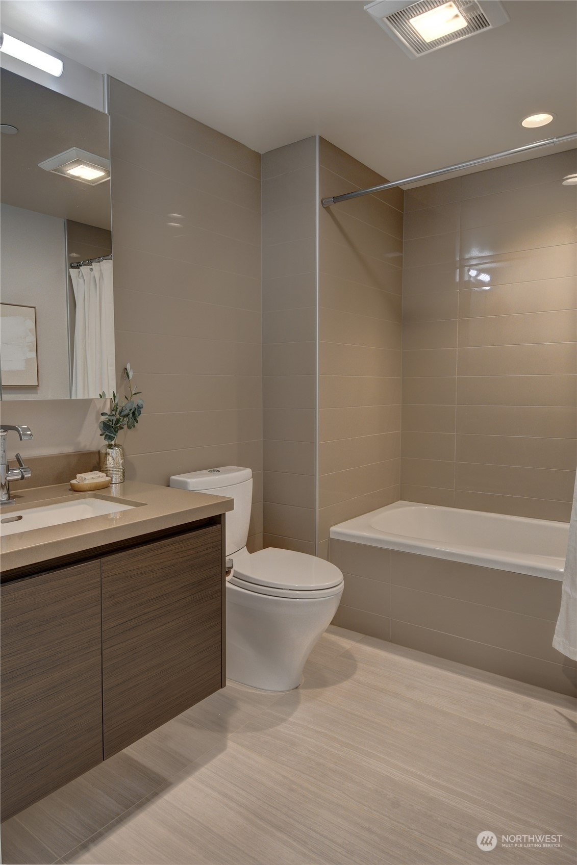 583 Battery Street, Unit 1601N Seattle, WA 98121 - Photo 10 of 27 a bathroom with a sink a toilet and shower