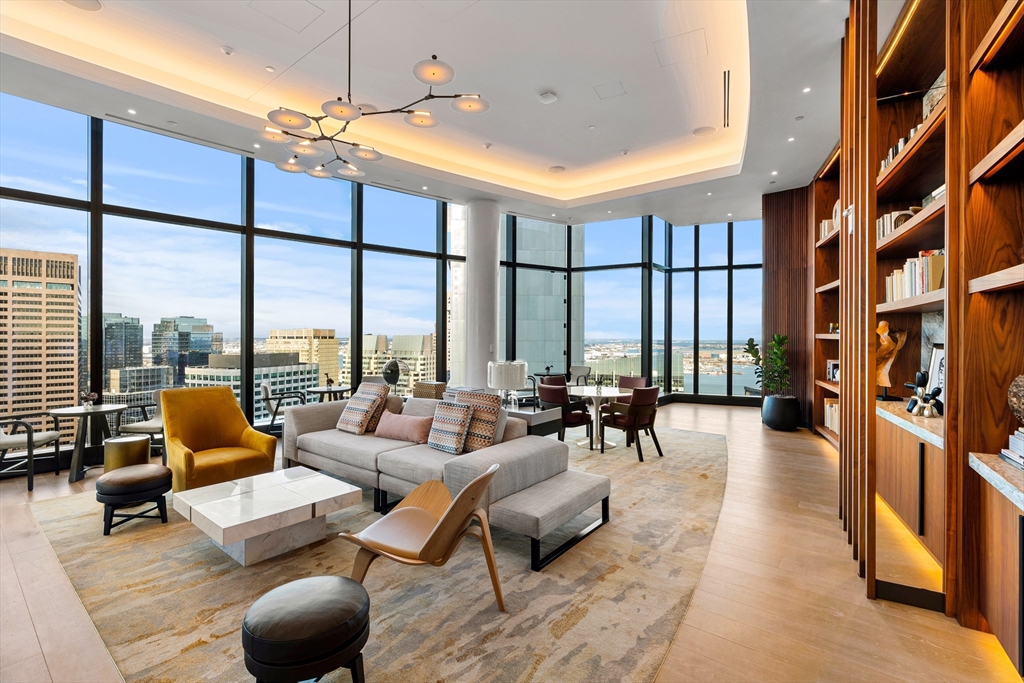 682 Atlantic Avenue, Unit 37D Boston, MA 02111 - Photo 21 of 42 a living room with furniture and floor to ceiling windows
