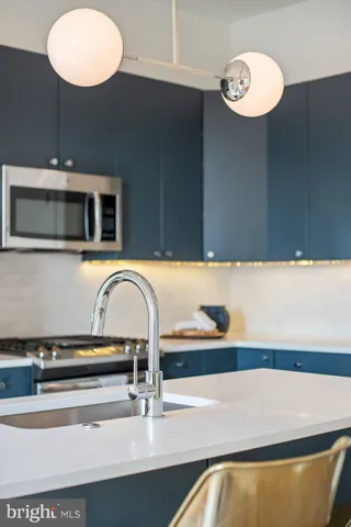 a kitchen with a stove and a refrigerator