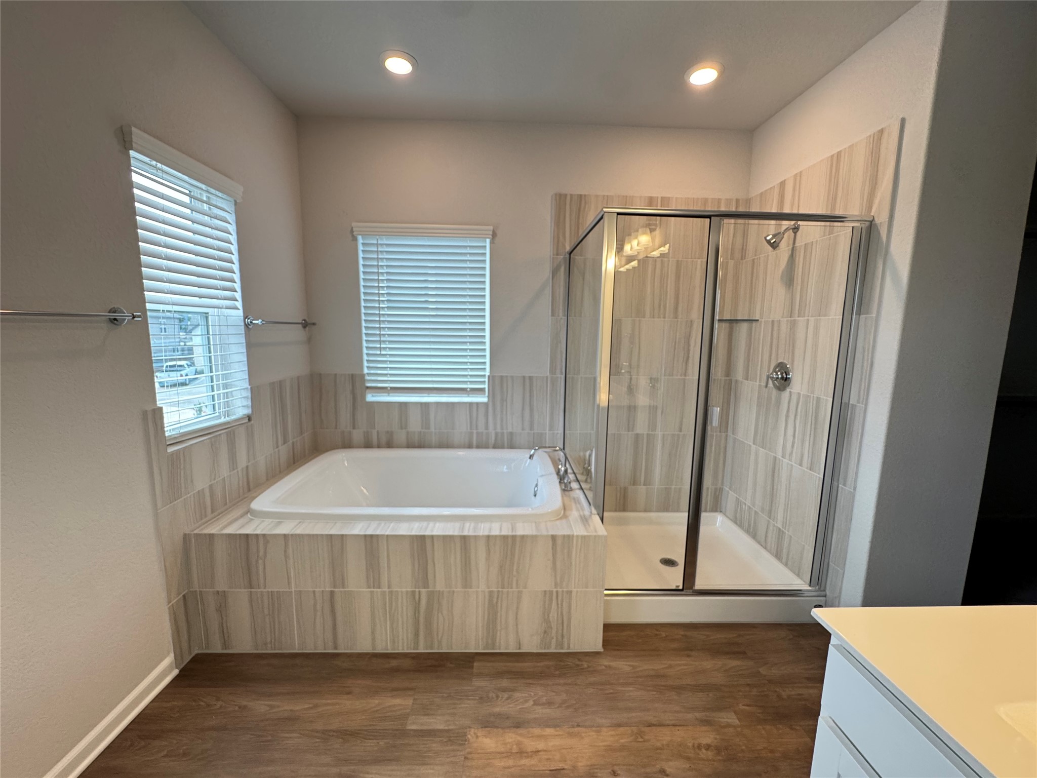 3000 Chisholm Trail Road, Unit 3 Round Rock, TX 78681 - Photo 15 of 28 a bathroom with a tub a rug a window and a shower