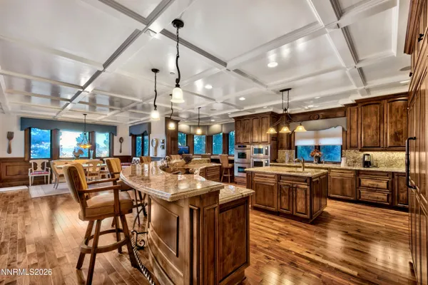 a open kitchen with stainless steel appliances granite countertop a stove and refrigerator