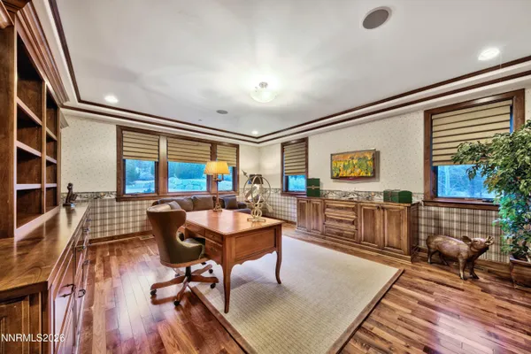 a living room with furniture a rug and a window