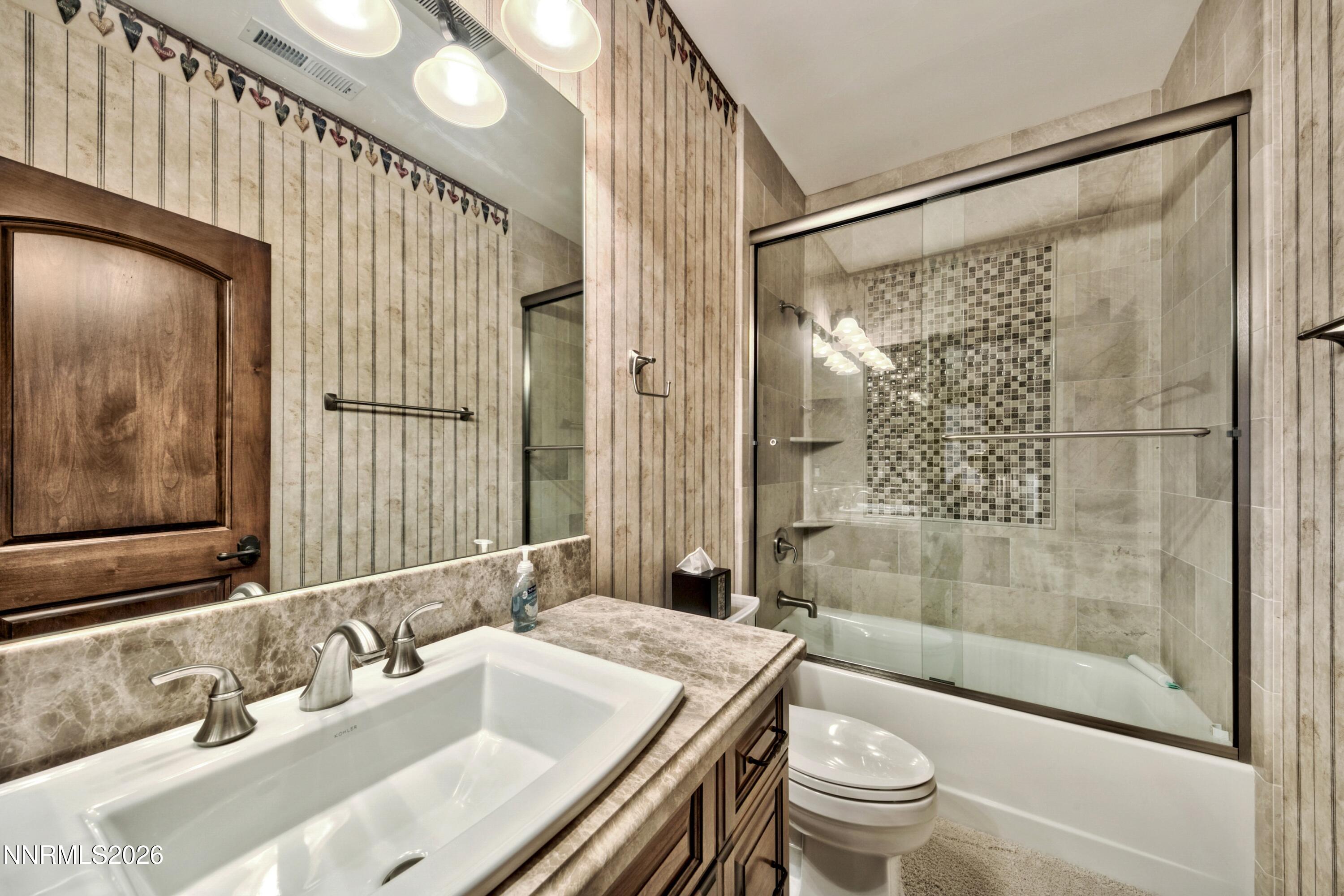 229 Five Creek Road Gardnerville, NV 89460 - Photo 27 of 50 a bathroom with a sink and a mirror