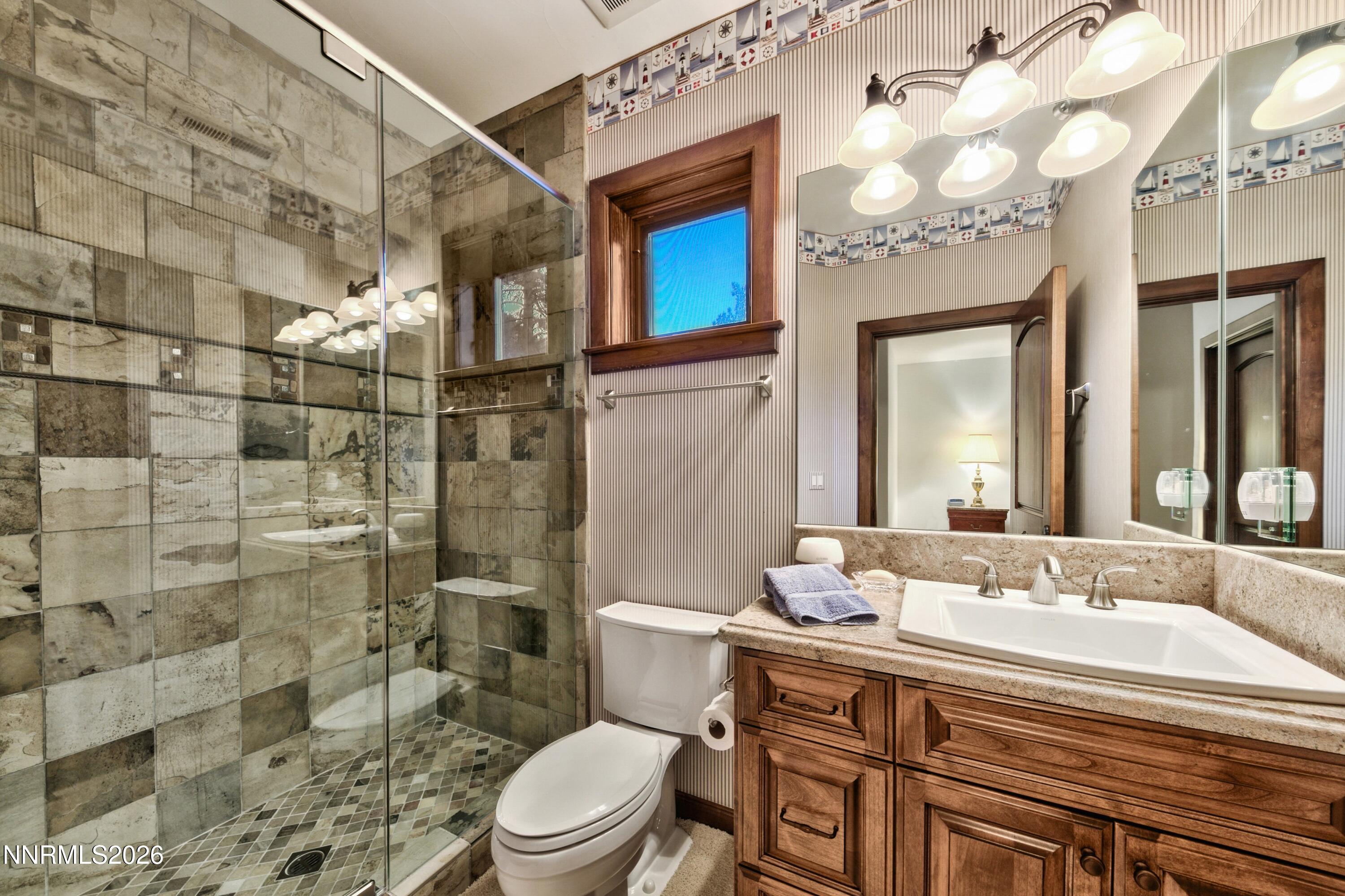 229 Five Creek Road Gardnerville, NV 89460 - Photo 29 of 50 a bathroom with a sink a toilet and shower