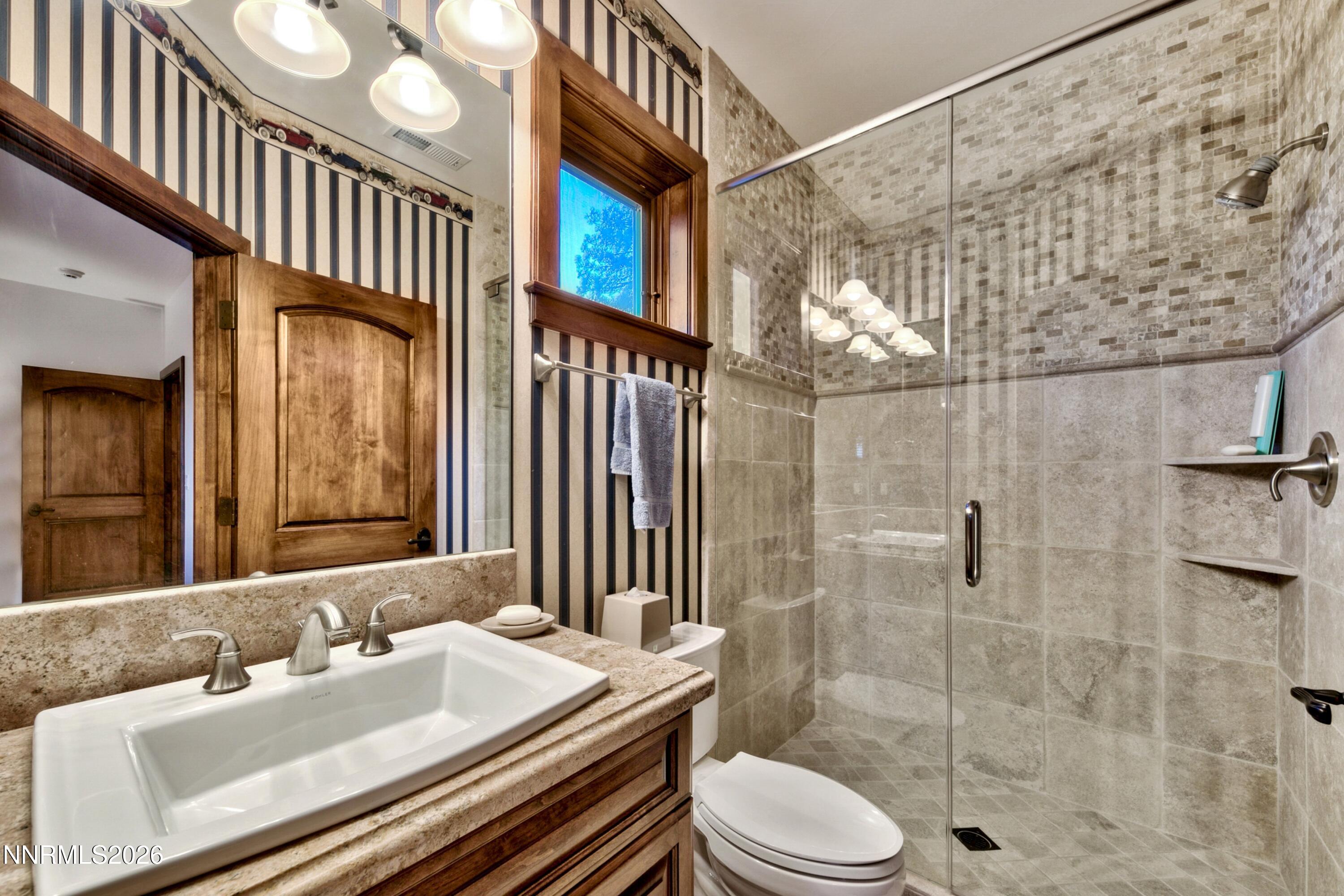 229 Five Creek Road Gardnerville, NV 89460 - Photo 30 of 50 a bathroom with a sink toilet and shower
