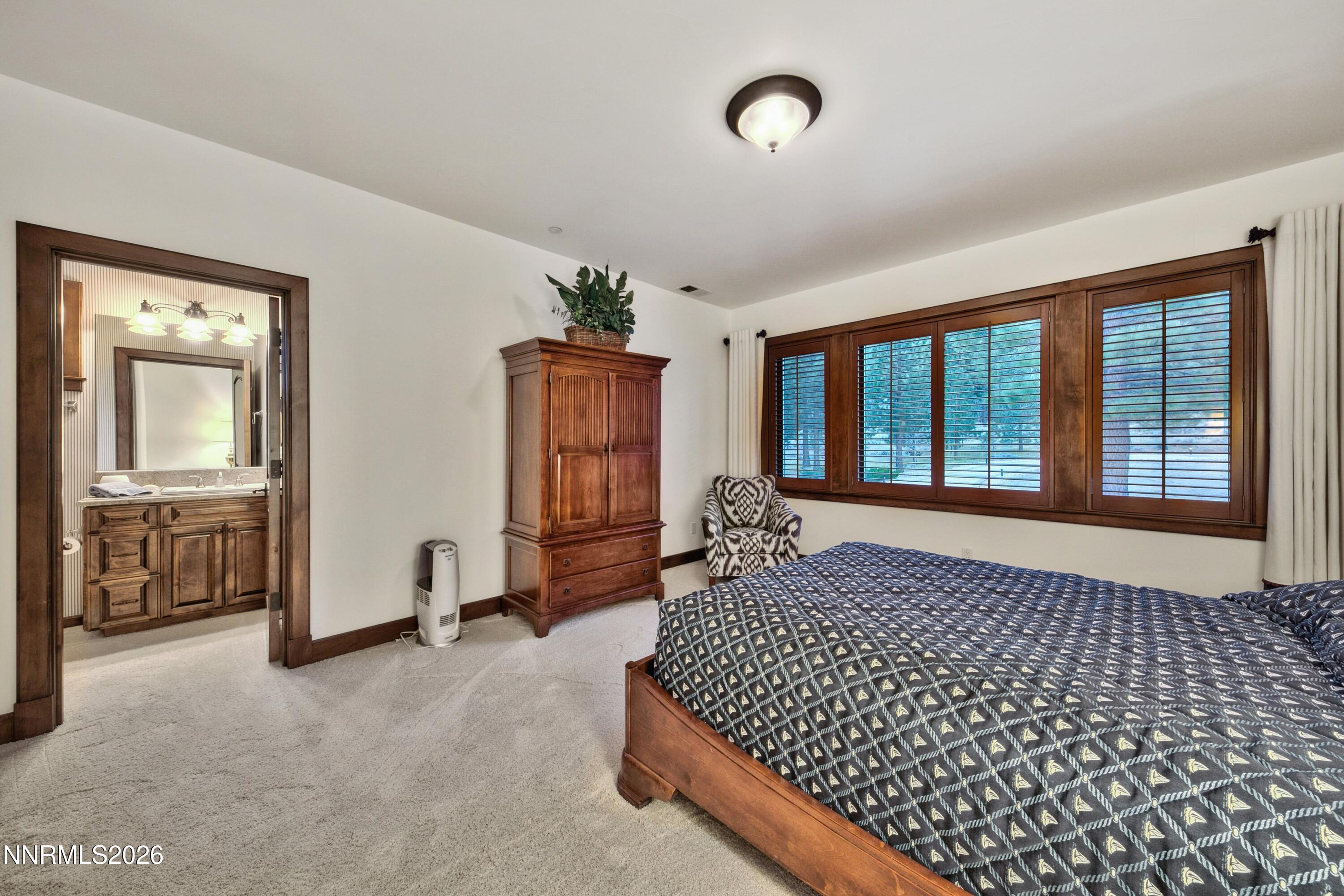229 Five Creek Road Gardnerville, NV 89460 - Photo 31 of 50 a bedroom with bed and balcony