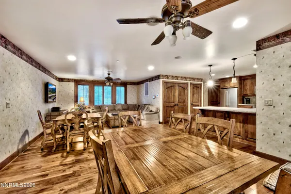 a view of a dining room with furniture window and wooden floor