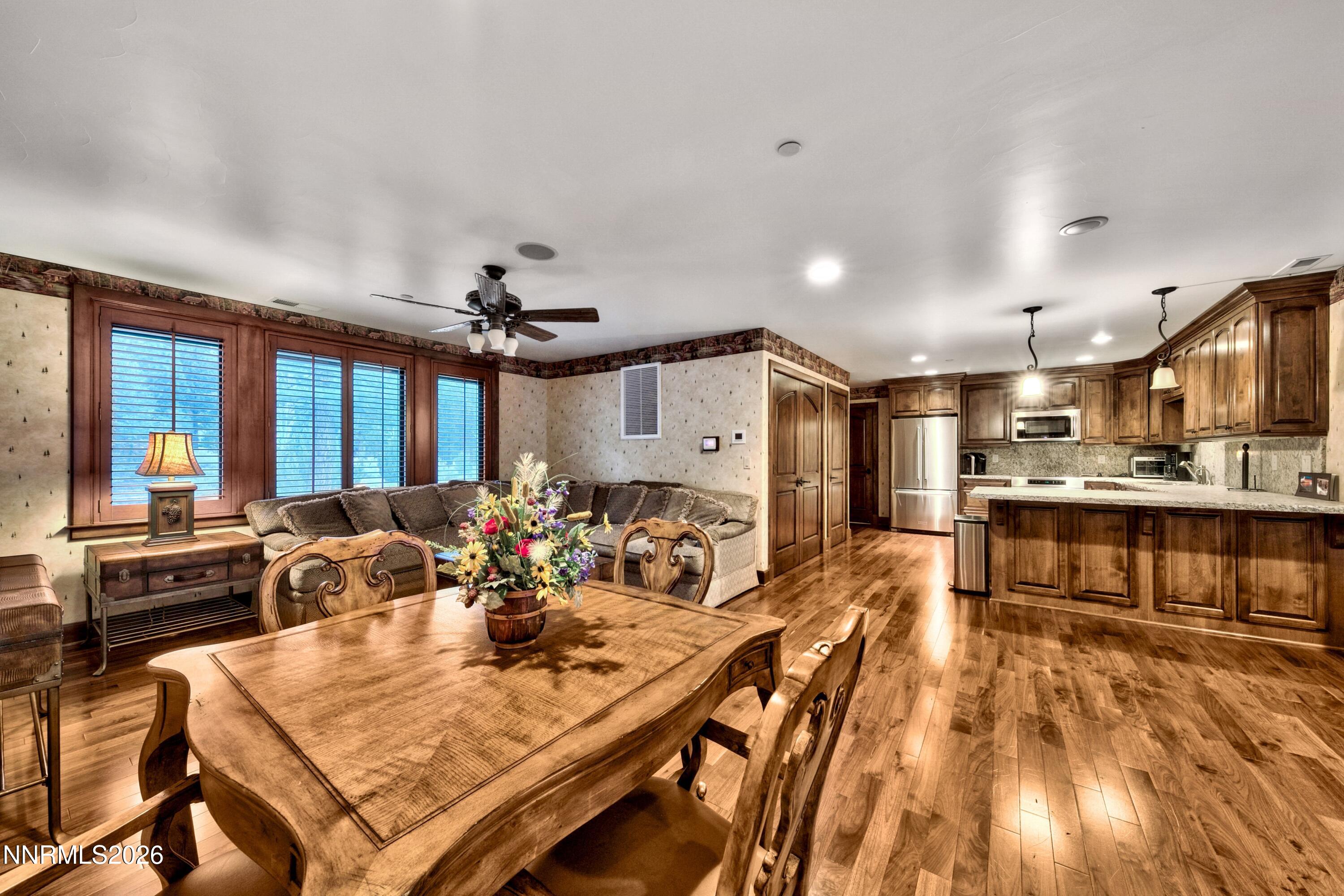 229 Five Creek Road Gardnerville, NV 89460 - Photo 33 of 50 a view of a dining room with furniture window and wooden floor