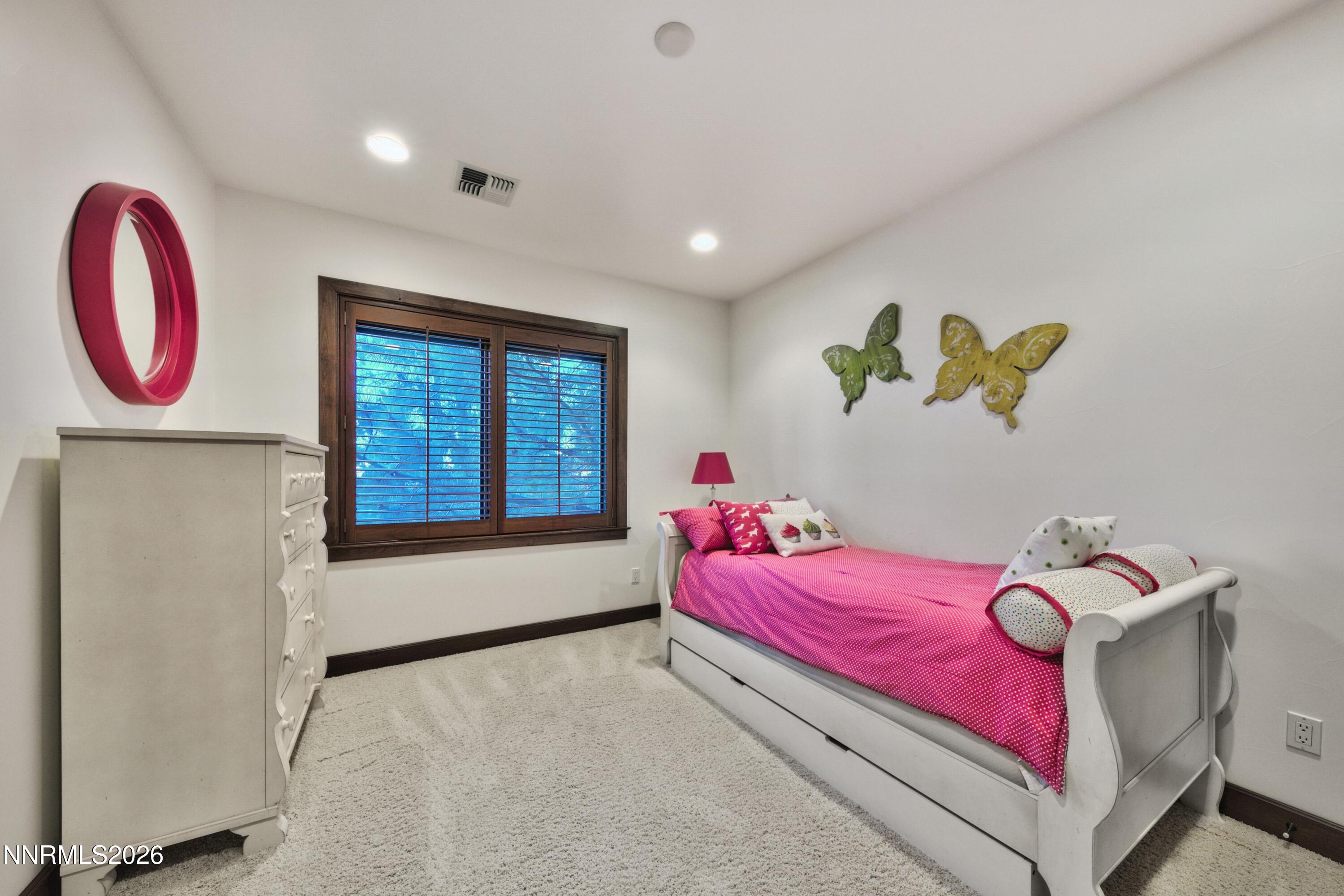 229 Five Creek Road Gardnerville, NV 89460 - Photo 35 of 50 a bedroom with a bed and a window