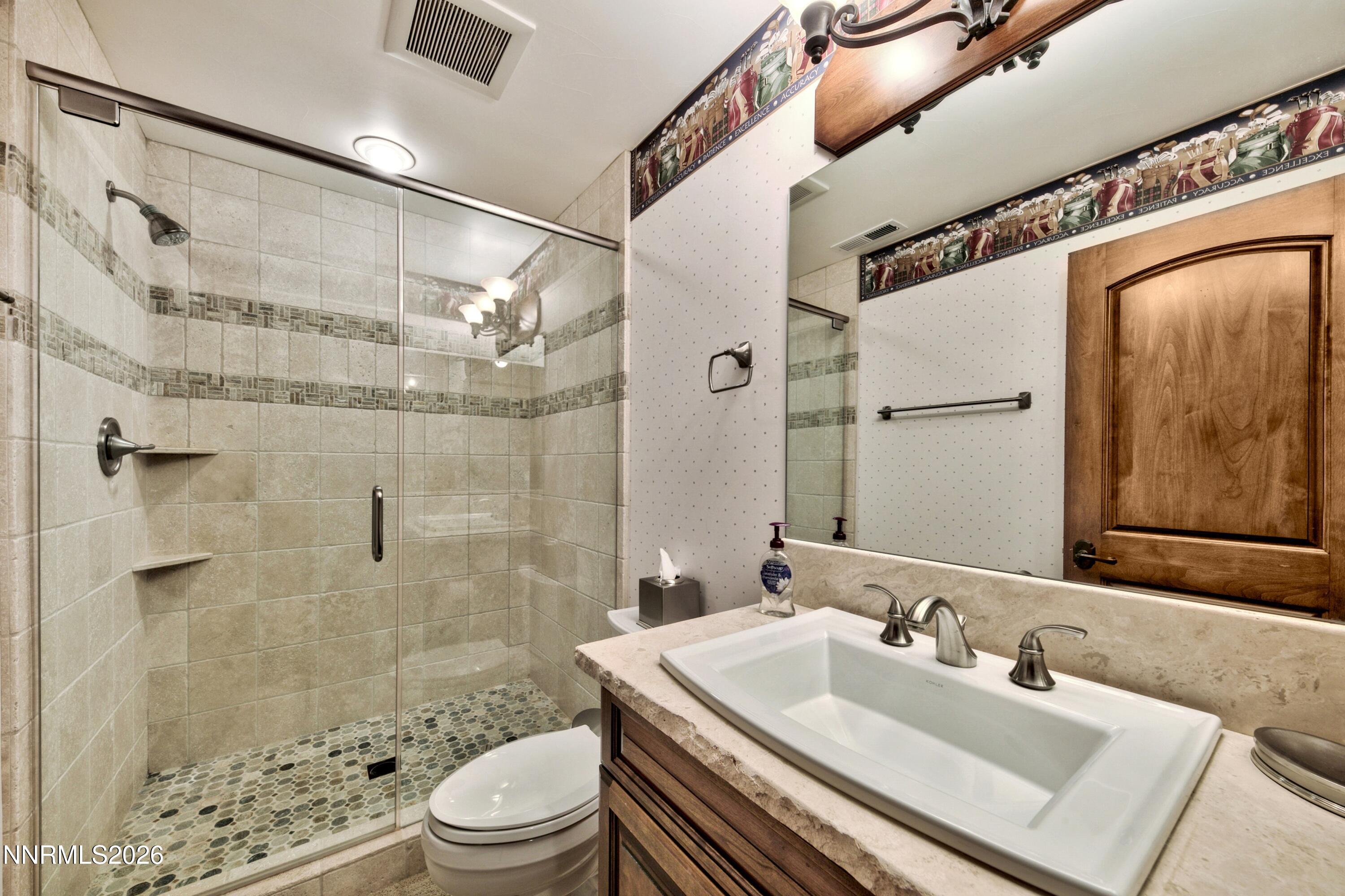 229 Five Creek Road Gardnerville, NV 89460 - Photo 36 of 50 a bathroom with a sink toilet and shower