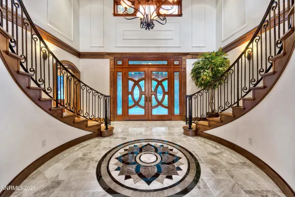 a view of entryway with a front door and a rug