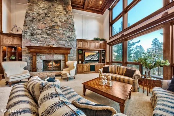 a view of a livingroom with furniture window and a fireplace